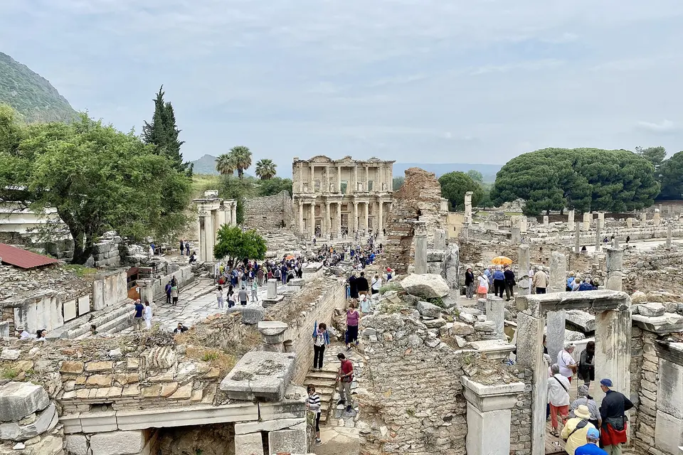 Visitors walking down the marble Curetes Street towards the Library of Celsus in Ephesus
